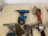 a lot of tools that are sitting on a table