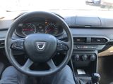 the interior of a car with a steering wheel and dashboard controls