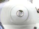 a white plate with a label on it sitting on a table