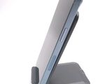 a cell phone that is sitting on top of a stand