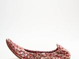 red and white patterned slippers on a white background
