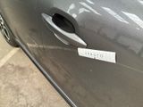 a sticker on the door of a car with a sticker attached to it