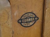 a close up of a wooden object with a logo on it