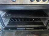 an open oven with a lot of food inside of it