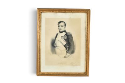 an old picture of a man in a military uniform holding a baby