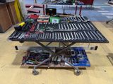 a table with a lot of tools on top of it