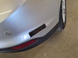 a close up of a car with a sticker on it ' s bumper