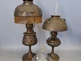 two lamps that are sitting next to each other on a table