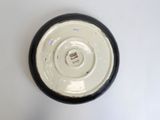 a black and white plate on a white table