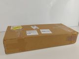 a box that is sitting on the floor next to a wall