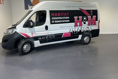 a white van that is parked in a room