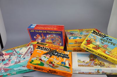 several children ' s board games sitting on top of a table