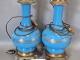 pair of blue and gold vases with a price tag on them