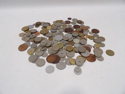 a pile of coins sitting on a white surface