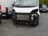 a white van that is sitting in a parking lot