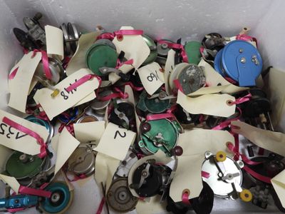 a box filled with assorted buttons and tags