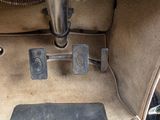 a picture of a car ' s floor with two pedals on it