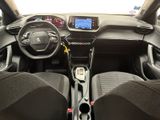 the interior of a car with a steering wheel and dashboard controls