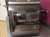 stainless steel counter top in a commercial kitchen with a toaster oven