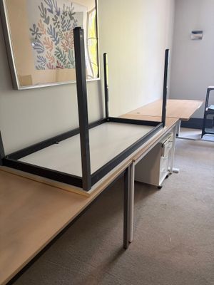 a desk with a mirror on top of it in a room
