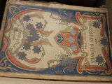 an old book sitting on a shelf in a room