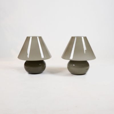pair of grey glass table lamps on a white background