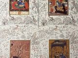 four framed pictures of oriental paintings on a wall in a room