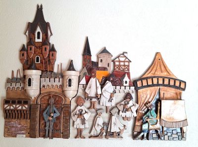a lot of wooden toys that are on the wall