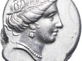 a close up of a coin with a woman ' s head on it