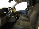 the interior of a vehicle with a steering wheel and a dashboard