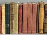 a lot of books that are sitting on a shelf