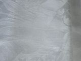 an image of a white table cloth with a bird on it