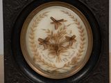 a picture of a clock with a picture of birds on it