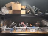 a shelf full of assorted office supplies on a desk