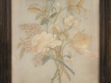 une photo d'un tableau représentant des fleurs, dans un cadre