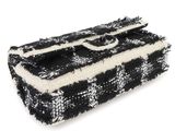 an image of a black and white purse on a white background