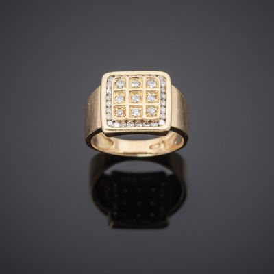 an 18k yellow gold ring set with diamonds