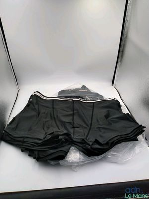 a box with a pair of black underwear in it