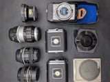a lot of different types of cameras on the table