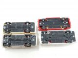 three toy trains sitting next to each other on a white surface