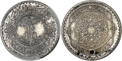 a close up of two silver coins on a white background