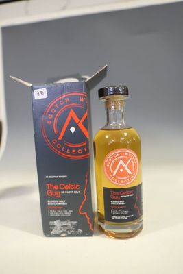 a bottle of wine sitting next to a box of wine
