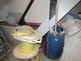 a picture of a room with a ladder, a bucket, and a hose