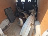 an image of a van with a surfboard and radiator