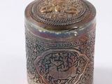 an image of a metal container with a design on the lid
