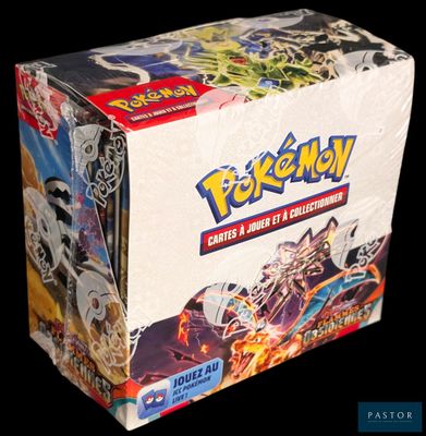 the box is full of pokemon cards on display on a black background