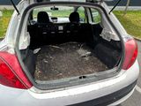 the back of a car with the trunk open and the seats down