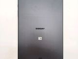 the back of a black samsung tablet with a sticker on it