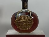 a bottle of liquor that is sitting on a stand