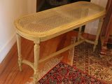 a table with a basket on top of it in a room